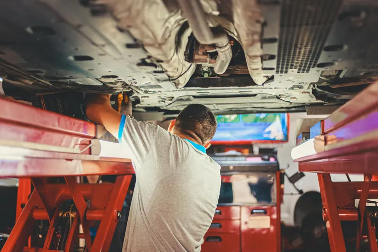 Vehicle raised for maintenance and underside inspection